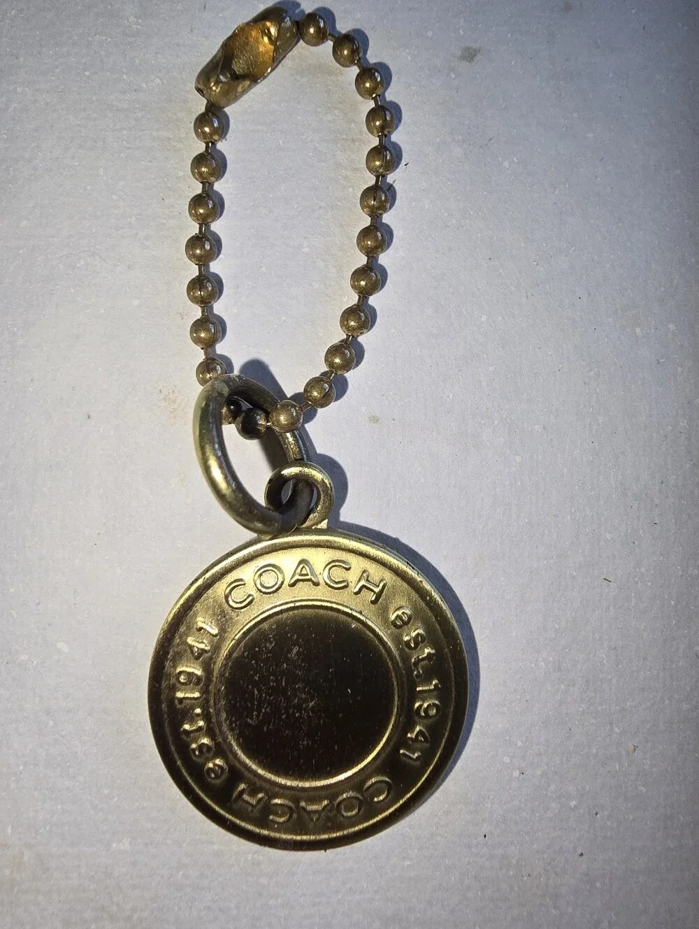 Coach Gold Tone Pendant Est 1941